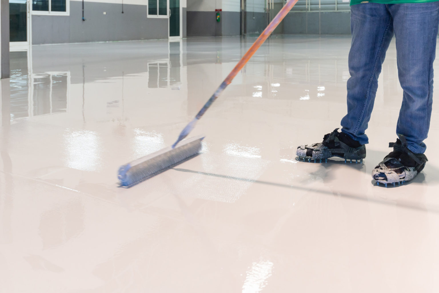 What is epoxy floor coating, and why is it a popular choice for residential and commercial properties?